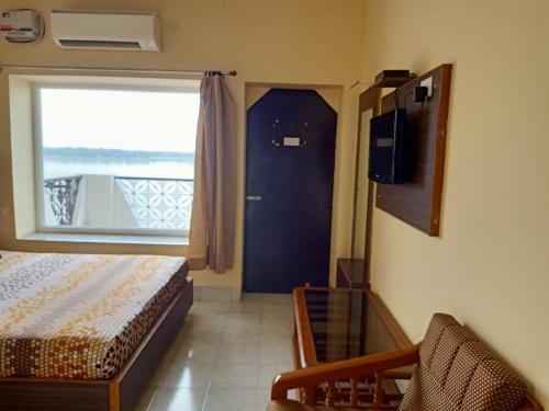 Postel nebo postele na pokoji v ubytování Scindhia Guest House