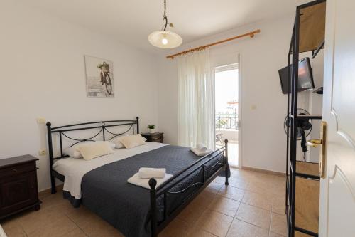 Ένα ή περισσότερα κρεβάτια σε δωμάτιο στο Toli apartments