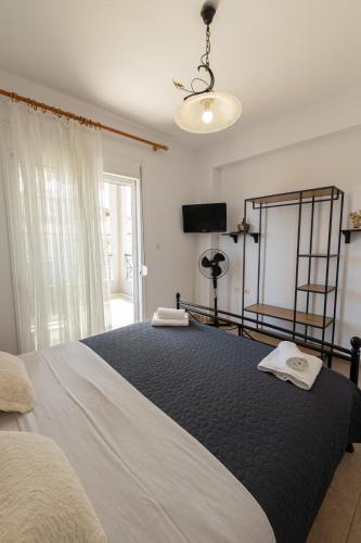 Ένα ή περισσότερα κρεβάτια σε δωμάτιο στο Toli apartments