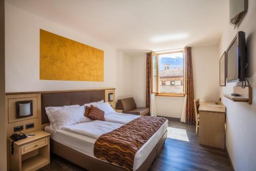 Postel nebo postele na pokoji v ubytování Hotel Portici - Romantik & Wellness
