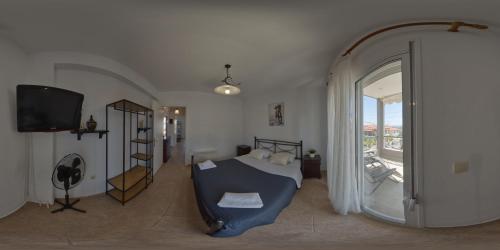 Ένα ή περισσότερα κρεβάτια σε δωμάτιο στο Toli apartments
