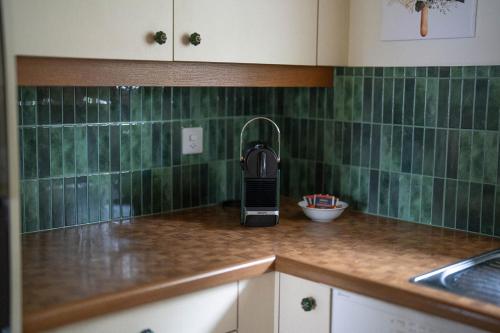 a cell phone sitting on a counter in a kitchen at Chalet Grittli in Beckenried
