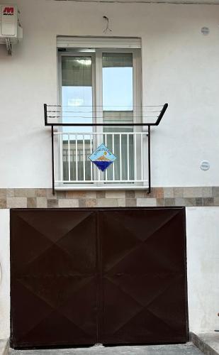 a building with a gate and a window at Sogno d'estate in Isola delle Femmine