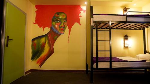 Ένα ή περισσότερα κρεβάτια σε δωμάτιο στο Rafiki Hostel