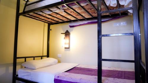 Ένα ή περισσότερα κρεβάτια σε δωμάτιο στο Rafiki Hostel