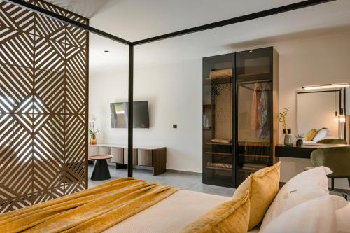 a bedroom with a bed with a wooden wall at X luxury suites in Argostoli