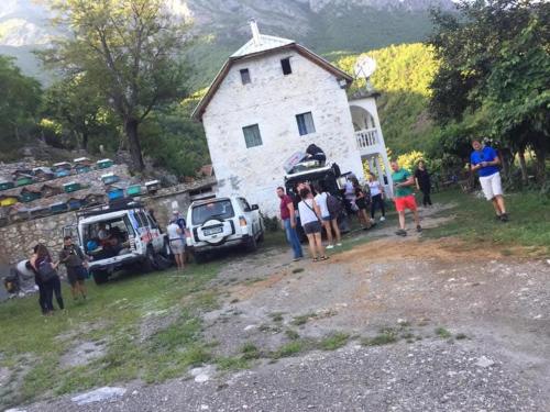 a group of people standing in front of a building at Guesthouse Lekaj in Kolgecaj