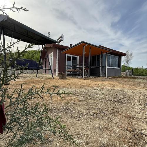 a small house with an orange roof at Atlas Tiny House in Perşembe