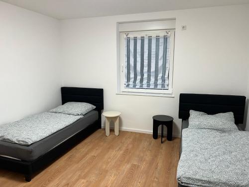 Postel nebo postele na pokoji v ubytování Arbeiter Monteur Wohnung