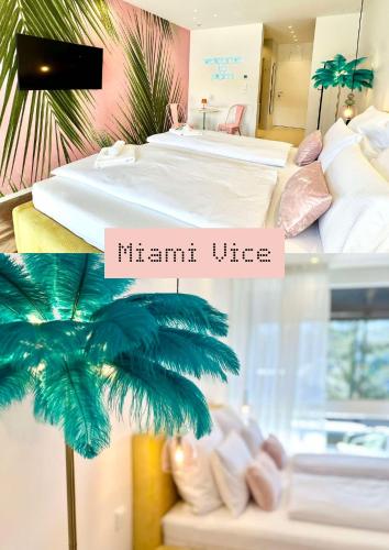 a hotel room with a bed and a palm tree at Miami Vice Appartement mit Balkon & Flussblick-Das Alpenzeit im Zentrum mit Parkplatz in Bad Aussee