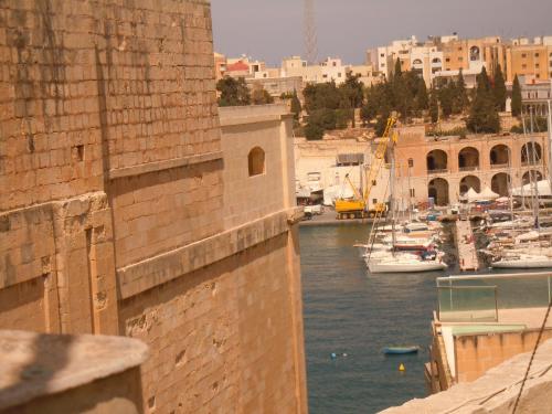 a view of a harbor with boats in the water at Number 12 in Birgu