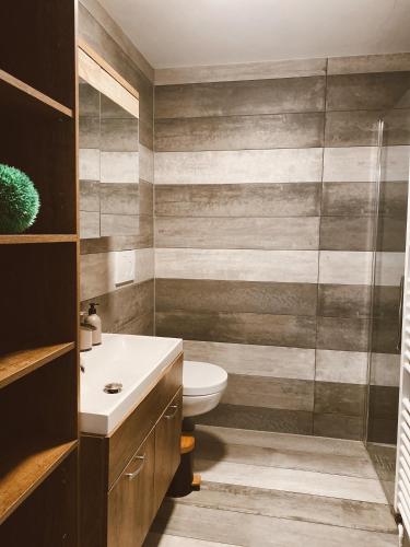 a bathroom with a toilet and a sink at EL Haus in Kassel