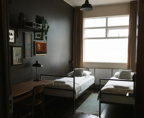 Una cama o camas en una habitación de KEX Hostel and Hotel