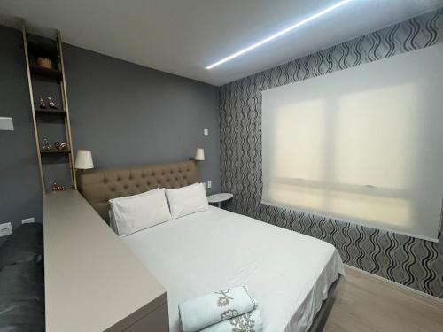 Ένα ή περισσότερα κρεβάτια σε δωμάτιο στο Blend Marista! Café da manhã Premium no Ibis!