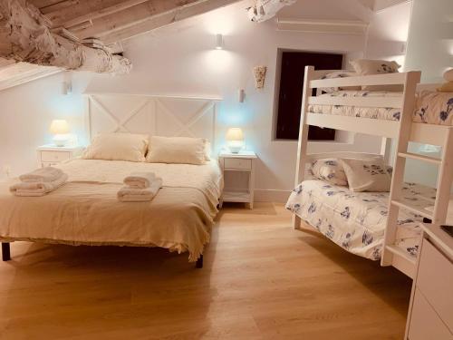 a bedroom with two bunk beds and twounks at La Tahona in Orbaneja del Castillo