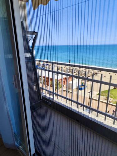 a balcony with a view of the beach at Horizonte 3 Charming apartment with breathtaking sea view at first line of Fuengirola beach in Fuengirola