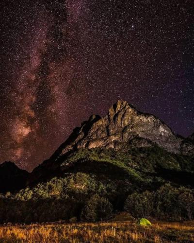 a starry night with a mountain and the milky way at ETHNO STAR Bojović in Gusinje