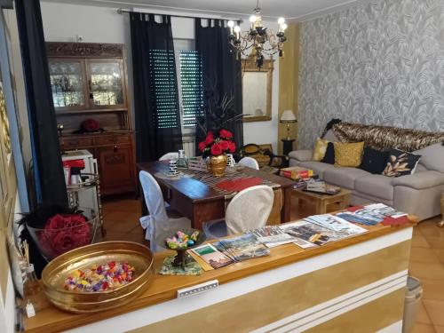 a living room with a table and a couch at La Sosta in Lunigiana in Monti di Licciana Nardi