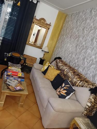 a living room with a couch and a table at La Sosta in Lunigiana in Monti di Licciana Nardi