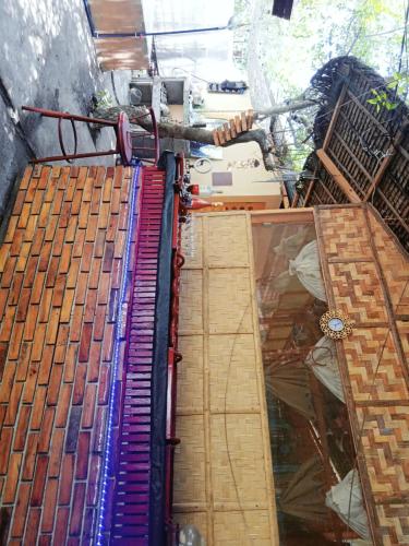 a pile of keyboards sitting on the floor in a room at SECLUDED GLAMPING YOGA SAMADHI fan 2 kubos 8 pax in Rimus