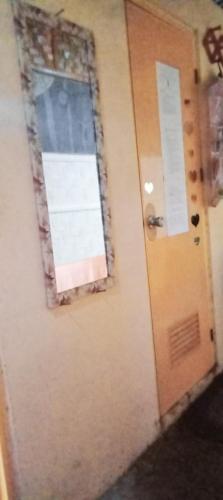 a door with a window in a room at SECLUDED GLAMPING YOGA SAMADHI fan 2 kubos 8 pax in Rimus