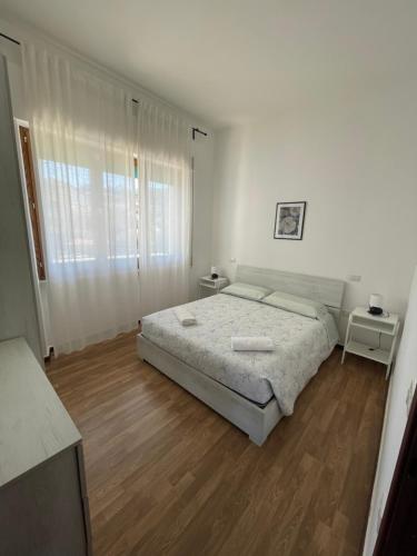 A bed or beds in a room at Casa Azzurra
