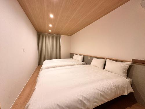 Cama o camas de una habitación en Aoi Suite Takayama