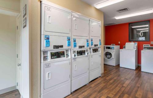 a room with a bunch of white washers and dryers at Extended Stay America Suites - Louisville - Dutchman in Louisville