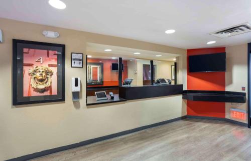 a lobby with a waiting room with a mirror at Extended Stay America Suites - Long Island - Bethpage in Bethpage