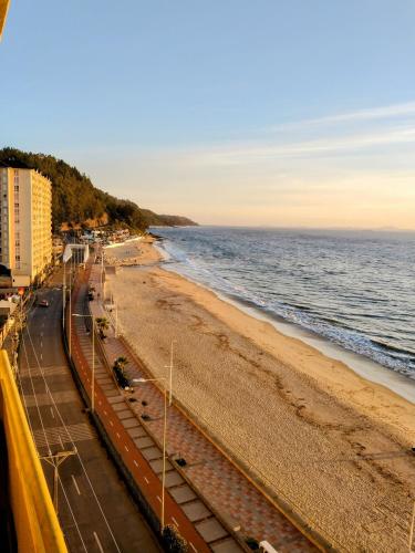 a view of a beach and the ocean at Departamentos Playa Bellavista 2025 in Tomé