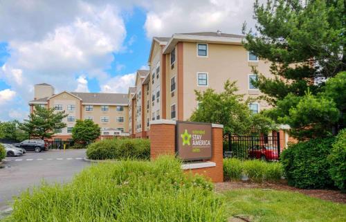 a building with a sign in front of a parking lot at Extended Stay America Suites - Elizabeth - Newark Airport in Elizabeth