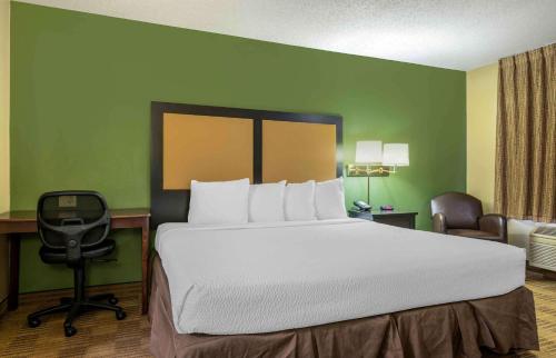 a bedroom with a bed and a desk and a chair at Extended Stay America Suites - South Bend - Mishawaka - North in South Bend