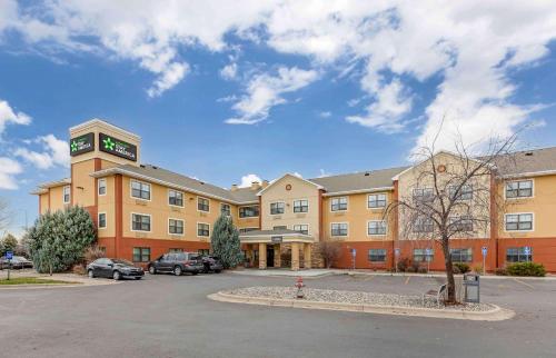 a large building with a clock tower in a parking lot at Extended Stay America Suites - Billings - West End in Billings