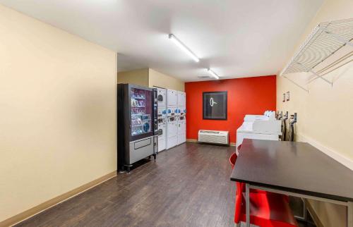 a room with a video game machine and a table at Extended Stay America Suites - Billings - West End in Billings