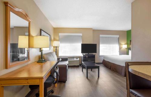 a large hotel room with a bed and a desk at Extended Stay America Suites - Meadowlands - East Rutherford in East Rutherford