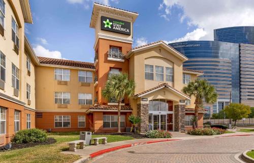 a hotel building with a sign on top of it at Extended Stay America Suites - Houston - Med Ctr - NRG Park - Braeswood Blvd in Houston