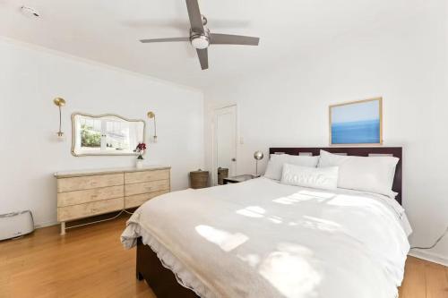 a bedroom with a large bed and a ceiling fan at Echo Park Hills in Los Angeles