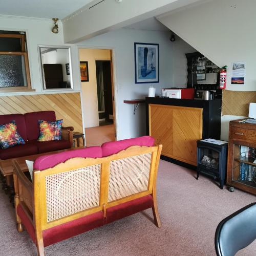 a living room with a couch and a table at Spacious 2 bedroom apartment in Whangarei