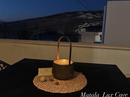 a basket sitting on top of a table at MATALA * LUX CAVE in Matala
