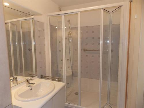 a bathroom with a shower and a sink at Appartement centre Luchon, balcon sud, parking - FR-1-313-243 in Luchon