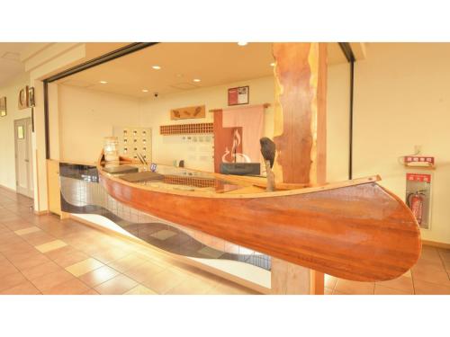 a wooden boat is on display in a museum at Hotel Hounomai Otofuke - Vacation STAY 29499v in Otofuke