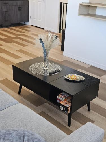 a black coffee table in a living room at Newly Renovated Modern Studio in Oviedo