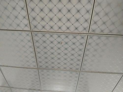 a white tiled ceiling with a wire at Anparasi Home in Point Pedro