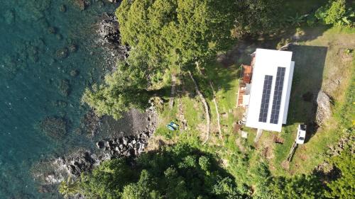 an aerial view of a building on the side of the water at Waterfront modern 3br home Vale Ni Vonu in Nggathavulu