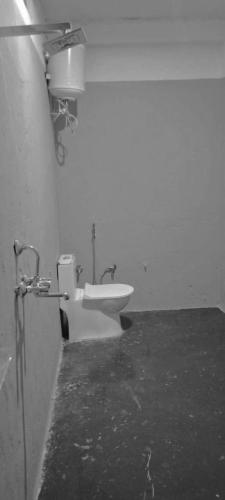 a bathroom with a sink and a toilet at Hotel Prakriti Darshan in Bhatwāri