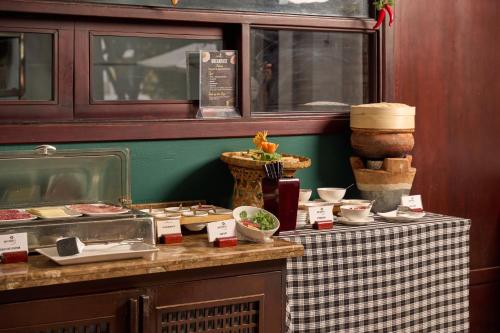 a table with food on top of a counter at Hoi An Odyssey Hotel & Spa in Hoi An