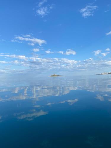 a view of the ocean with clouds in the sky at La Casa di Peppe in Capaci