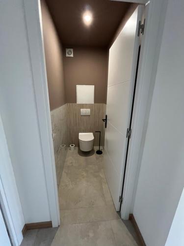 a bathroom with a toilet in a room at Bayt Al Nour in Givet