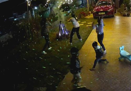 a group of people standing on a street at night at KODAI RiYA PARADISE in Kodaikānāl