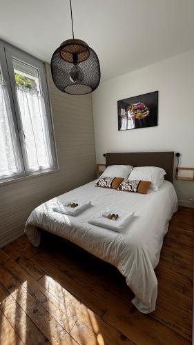 Katil atau katil-katil dalam bilik di Superbe duplex climatisé avec jardin classé 3 étoiles 2 à 4 pers